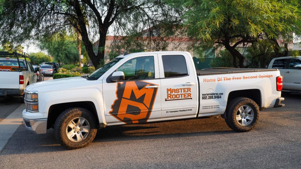 a white truck with the master rooter logo