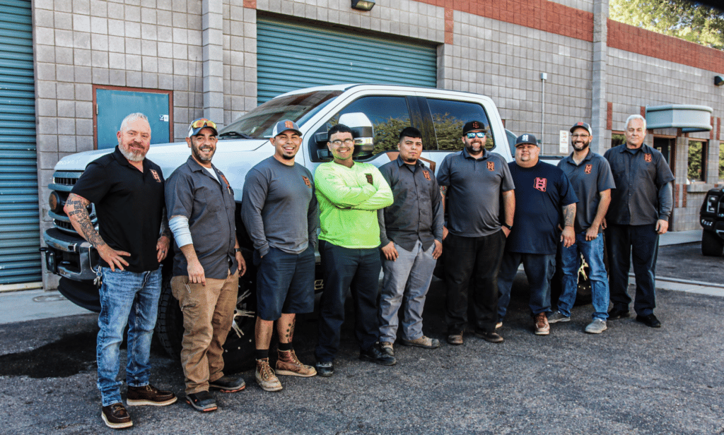 the master rooter team in front of a truck