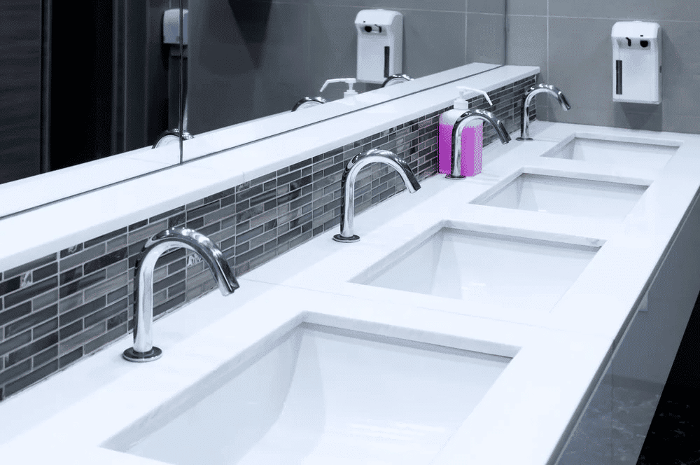 a row of white sinks